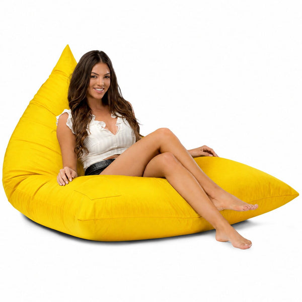 lady sitting on a yellow bermuda triangle outdoor bean bag from bean bags r us