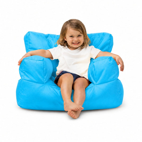 smiling young girl posing on an aqua kids bean bag chair