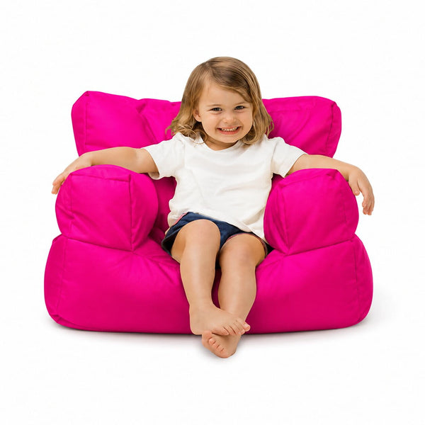 smiling young girl posing on a pink kids bean bag chair