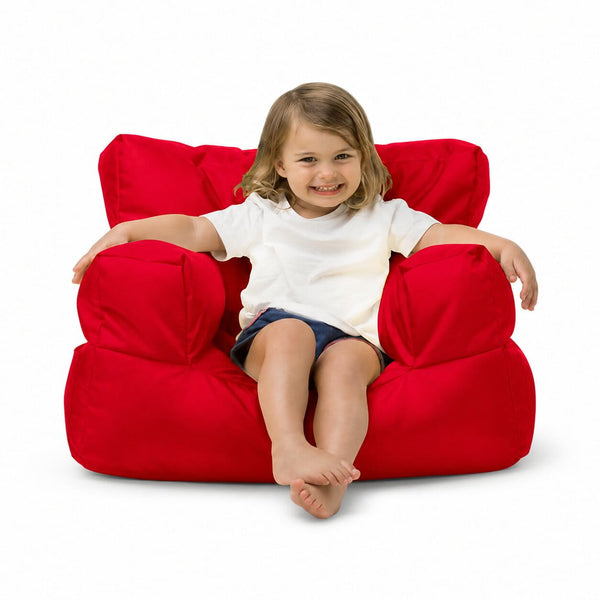 smiling young girl posing on a red kids bean bag chair