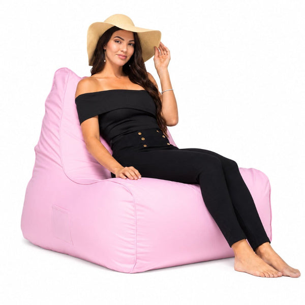 lady posing on a pink copacabana outdoor bean bag chair
