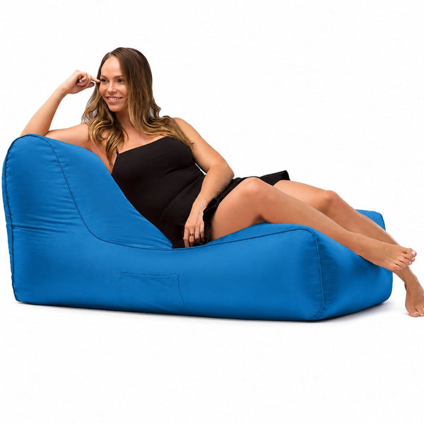 lady posing on a media lounge outdoor bean bag lounger in blue