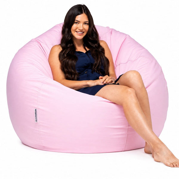 lady posing on a pink positano outdoor bean bag