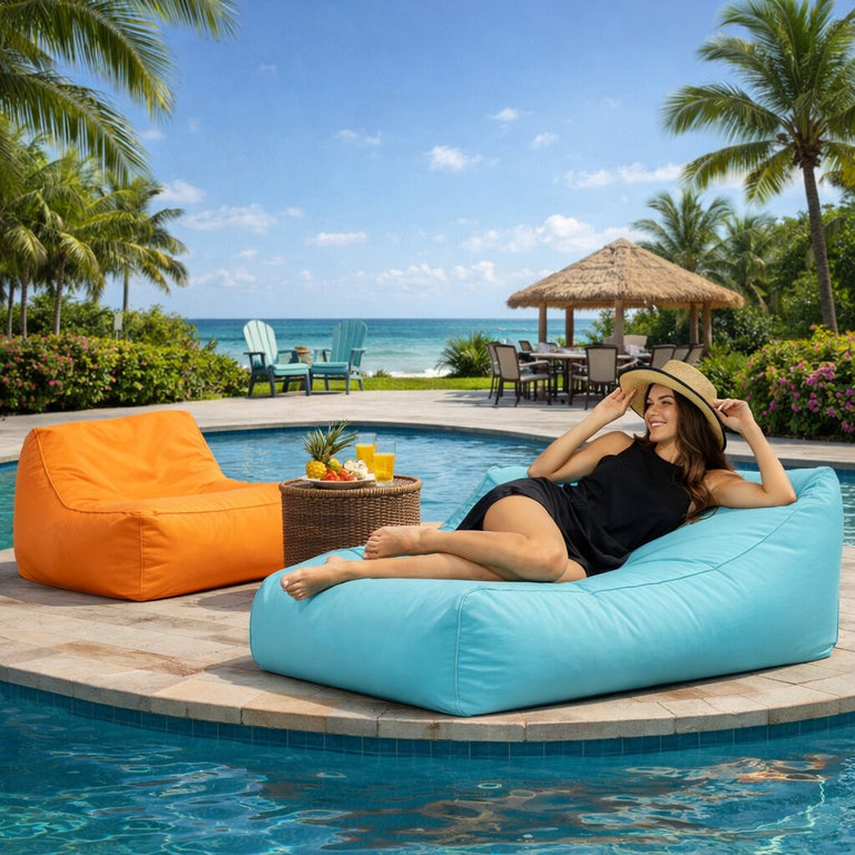 lady posing on a poolside bean bag chair at a resort