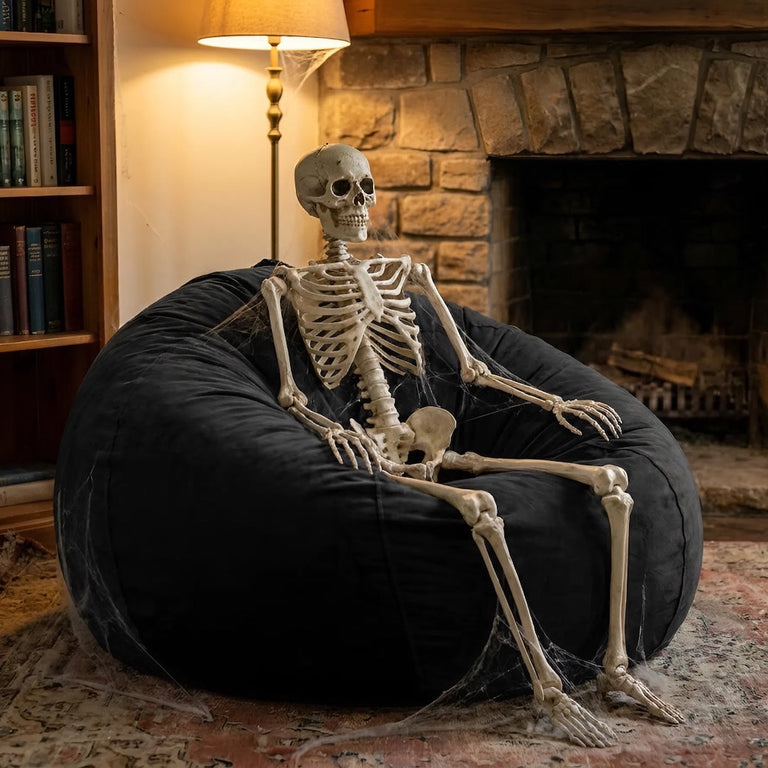 A skeleton sitting on a very old dusty bean bag chair from the 70s - how long does a bean bag last | Bean Bags R Us