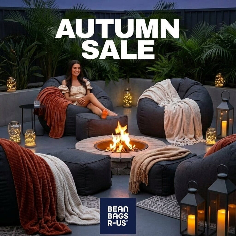 autumn sale banner with lady sitting on a bean bag around a fire pit