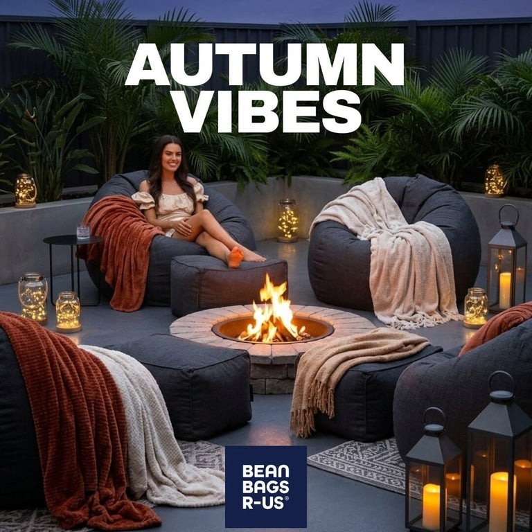 outdoor bean bags surrounding a fire pit in a yard