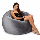 happy lady posing on a grey velvet bean bag chair — thumbnail 6