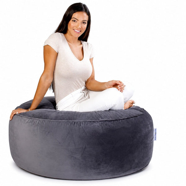 lady posing on a grey velvet bean bag ottoman by bean bags r us — image 6