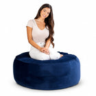lady posing on a blue velvet bean bag ottoman by bean bags r us — thumbnail 5