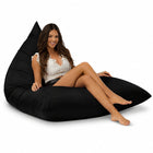 lady sitting on a black bermuda triangle outdoor bean bag from bean bags r us — thumbnail 7