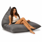 lady sitting on a grey bermuda triangle outdoor bean bag from bean bags r us — thumbnail 6