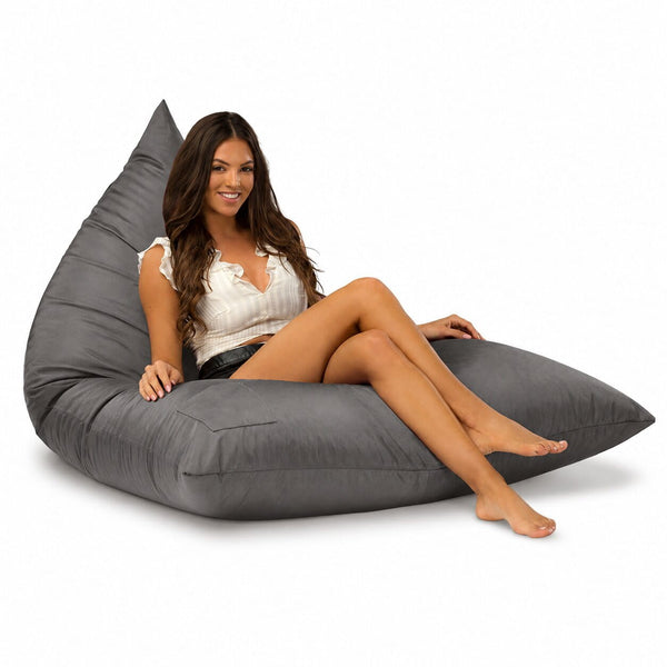 lady sitting on a grey bermuda triangle outdoor bean bag from bean bags r us — image 6