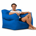 smiling man posing on a blue armchair bean bag — thumbnail 6