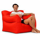 smiling man posing on a red armchair bean bag — thumbnail 8