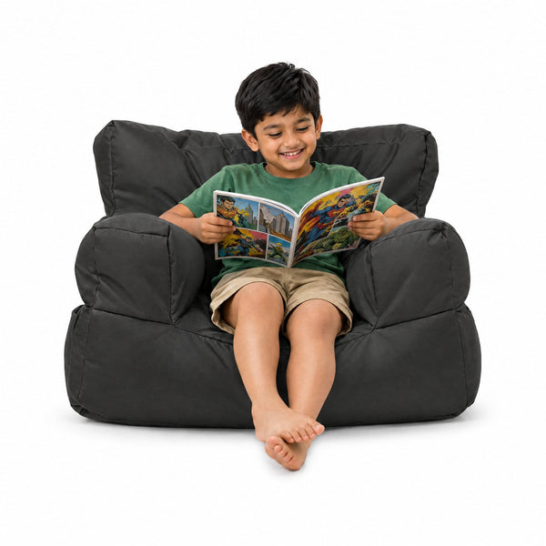 Billy the Kid in Charcoal - kids bean bag armchair with boy reading a comic, Bean Bags R Us — image 6