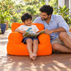Orange Billy the Kid kids outdoor bean bag armchair on a family deck, Bean Bags R Us — thumbnail 13