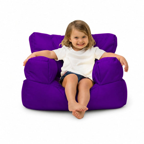 smiling young girl posing on a purple kids bean bag chair — image 15