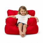 smiling young girl posing on a red kids bean bag chair — thumbnail 16