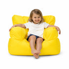 smiling young girl posing on a yellow kids bean bag chair — thumbnail 17