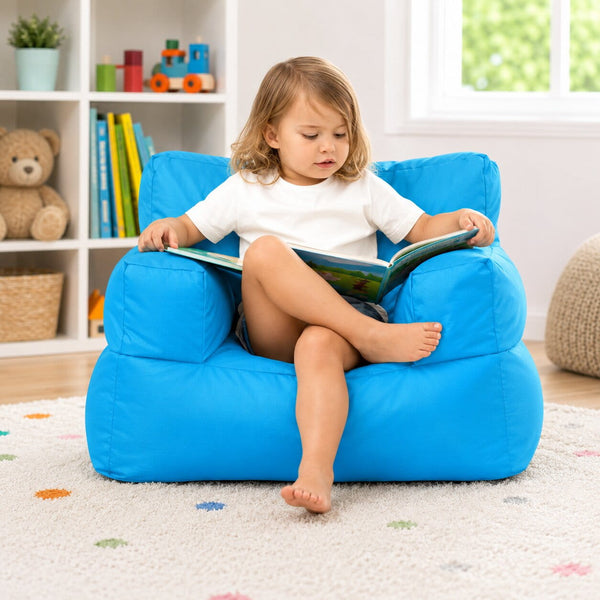 young girl posing on a blue kids bean bag chair in a kids room — image 6