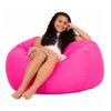 teenage girl sitting on a pink cotton beanbag chair