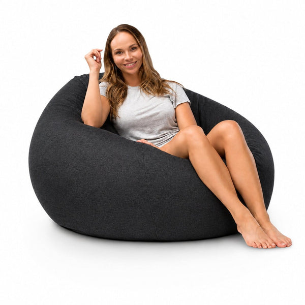 lady posing on a 104cm cuba denim bean bag in charcoal — image 3