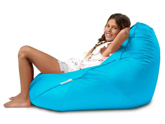 Person sitting on a blue bean bag chair against a white background