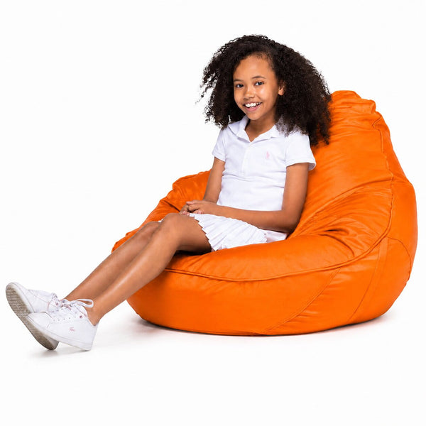 smiling teen girl sitting on a freaky cousin orange bean bag chair — image 8