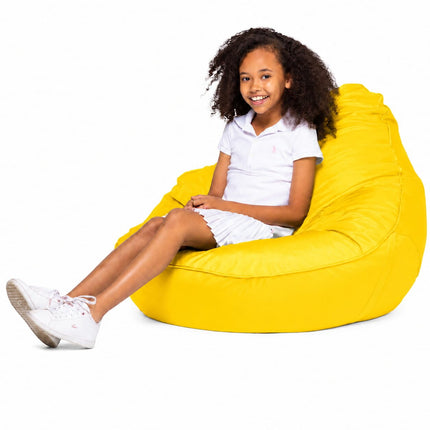 smiling teen girl sitting on a freaky cousin yellow bean bag chair
