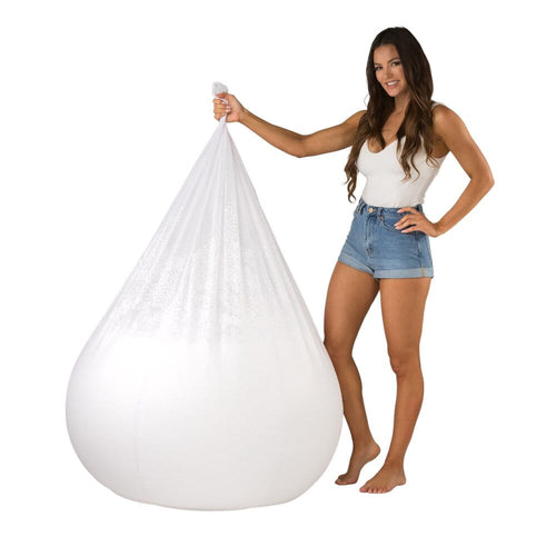 lady holding a bean bag liner filled with bean bag filling