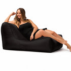 lady posing on a media lounge outdoor bean bag lounger in black — thumbnail 8