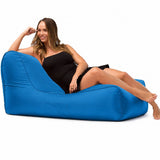 lady posing on a media lounge outdoor bean bag lounger in blue