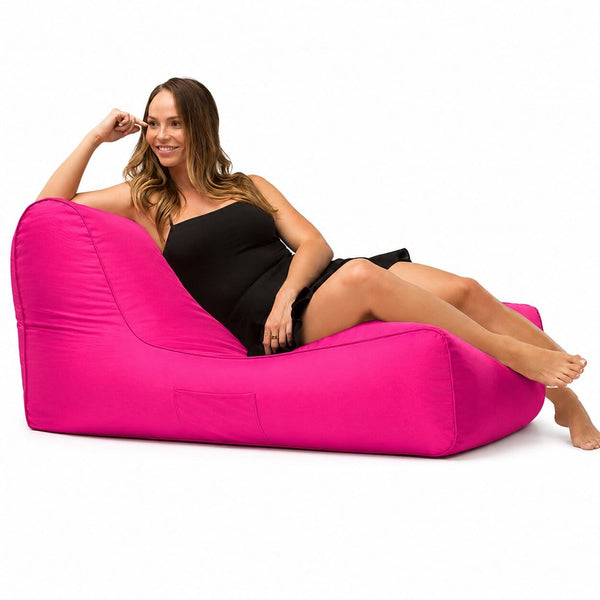 lady posing on a media lounge outdoor bean bag lounger in pink — image 4