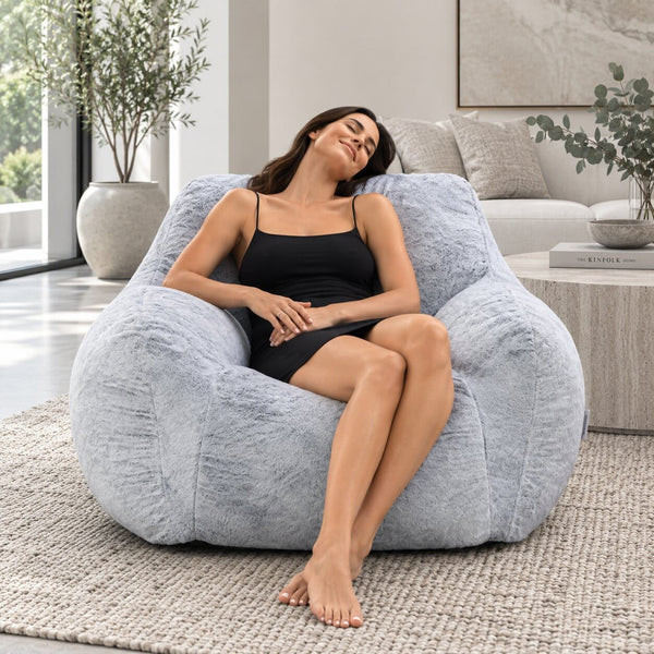 lady relaxing on a foam filled sensory bean bag chair  — image 6