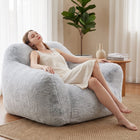 lady relaxing on a grey foam filled sensory bean bag chair  — thumbnail 7