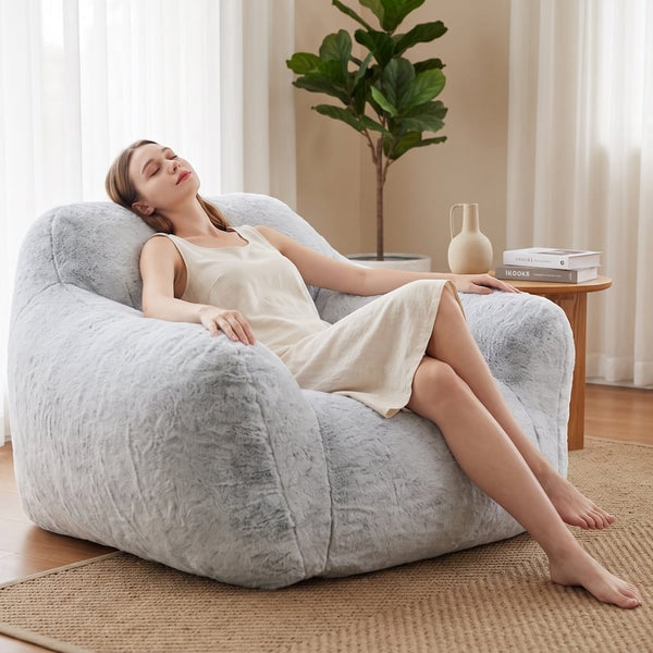 lady relaxing on a grey foam filled sensory bean bag chair  — image 7