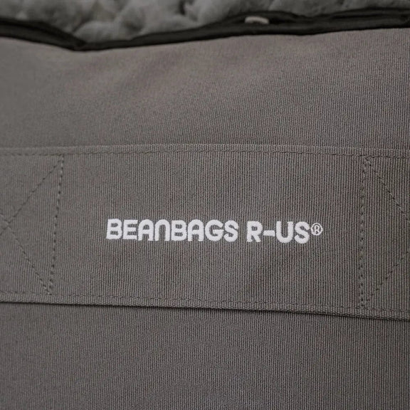 Gray beanbag with 'Beanbags R-Us' logo on a close-up of the fabric.